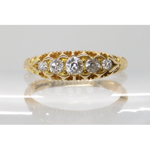 696 - AN 18CT GOLD FIVE STONE DIAMOND RING