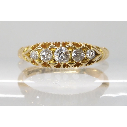 696 - AN 18CT GOLD FIVE STONE DIAMOND RING