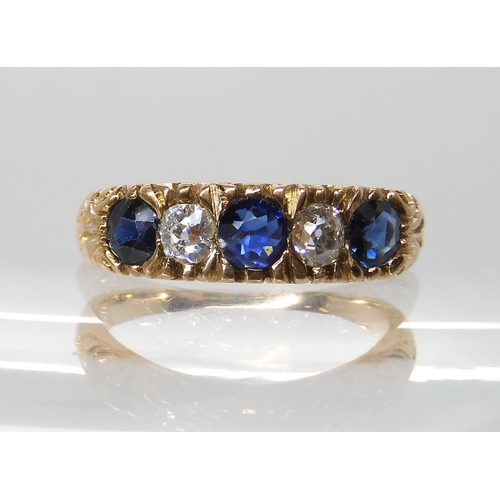 697 - AN 18CT FRENCH GOLD BLUE GEM AND DIAMOND RING