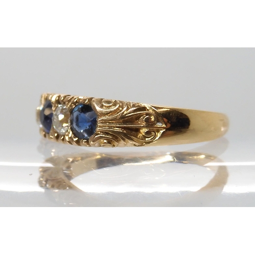 697 - AN 18CT FRENCH GOLD BLUE GEM AND DIAMOND RING