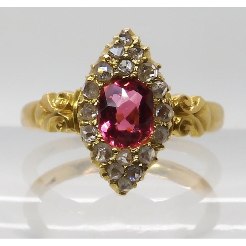 699 - A YELLOW METAL ROSE CUT DIAMOND AND PINK GEM SET RING