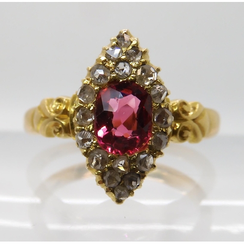 699 - A YELLOW METAL ROSE CUT DIAMOND AND PINK GEM SET RING