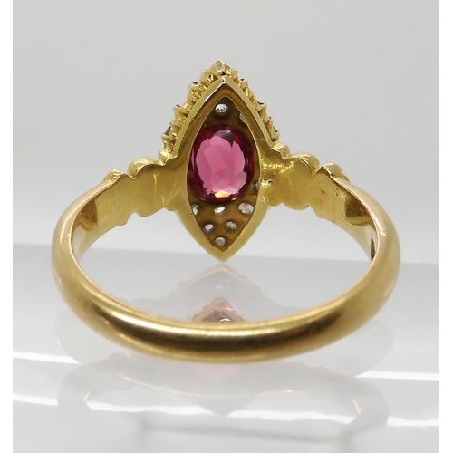 699 - A YELLOW METAL ROSE CUT DIAMOND AND PINK GEM SET RING