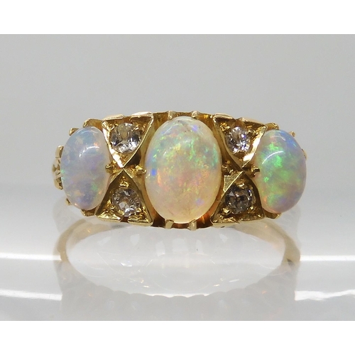 701 - AN 18CT GOLD OPAL AND DIAMOND RING