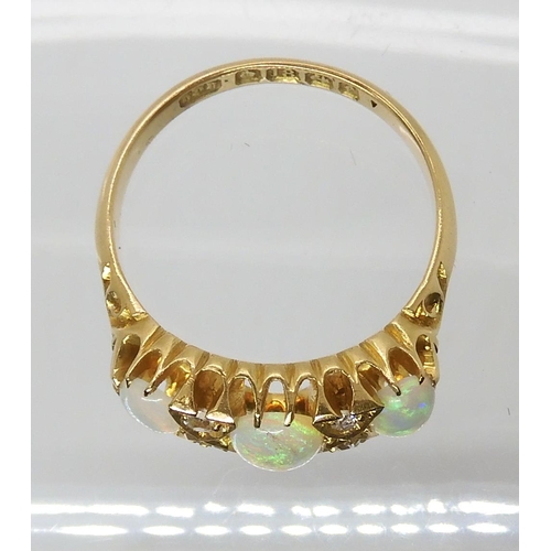 701 - AN 18CT GOLD OPAL AND DIAMOND RING