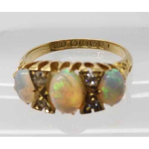 701 - AN 18CT GOLD OPAL AND DIAMOND RING