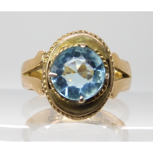 703 - AN 18CT GOLD BLUE GEM SET RING