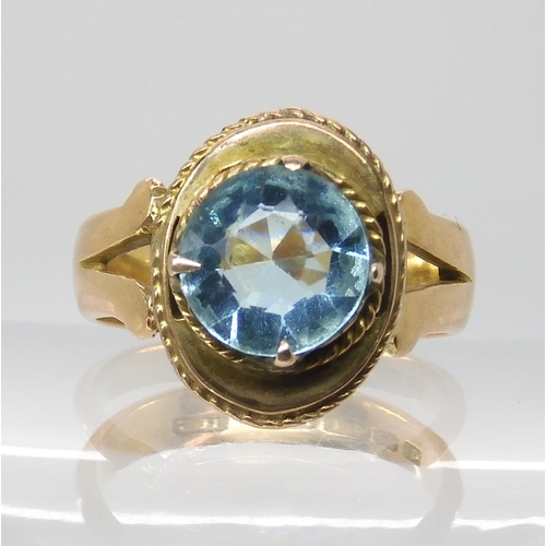 703 - AN 18CT GOLD BLUE GEM SET RING