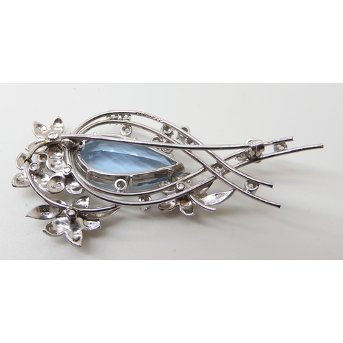 704 - AN 18CT WHITE GOLD AQUAMARINE  DIAMOND AND RUBY BROOCH