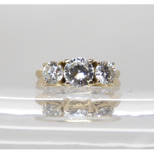 706 - AN 18CT YELLOW GOLD THREE STONE DIAMOND RING