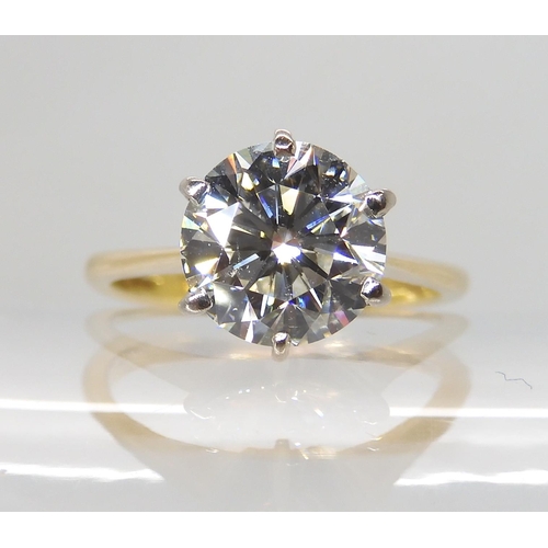 708 - AN 18CT YELLOW AND WHITE GOLD DIAMOND SOLITAIRE