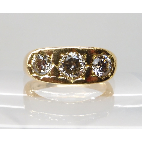 710 - AN 18CT GOLD GENTS THREE STONE DIAMOND RING