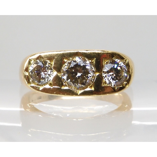 710 - AN 18CT GOLD GENTS THREE STONE DIAMOND RING