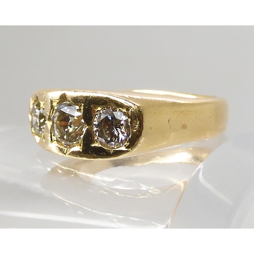 710 - AN 18CT GOLD GENTS THREE STONE DIAMOND RING