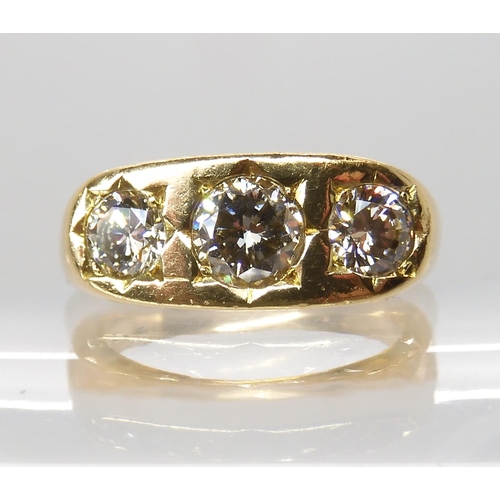 710 - AN 18CT GOLD GENTS THREE STONE DIAMOND RING