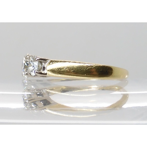 711 - AN 18CT GOLD THREE STONE DIAMOND RING