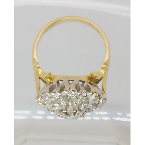 712 - AN 18CT GOLD DIAMOND CLUSTER RING