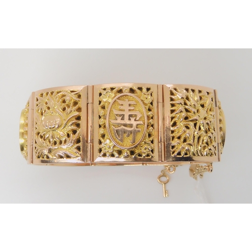 715 - A 14K GOLD CHINESE BANGLE