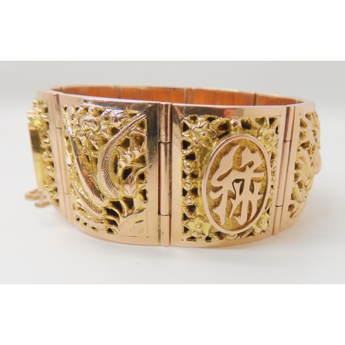 715 - A 14K GOLD CHINESE BANGLE