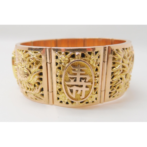 715 - A 14K GOLD CHINESE BANGLE