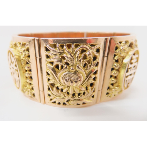 715 - A 14K GOLD CHINESE BANGLE