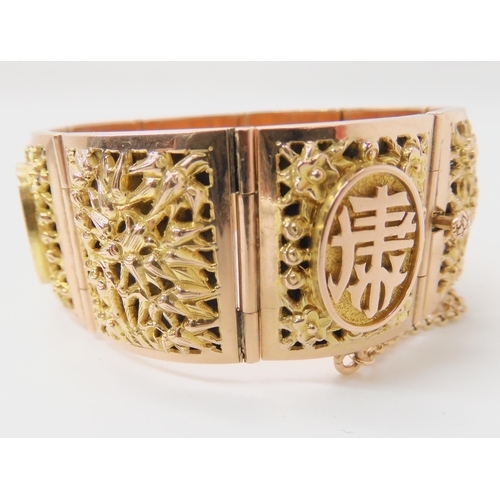 715 - A 14K GOLD CHINESE BANGLE