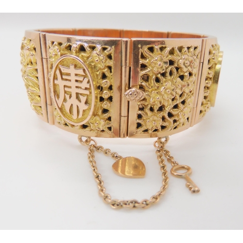 715 - A 14K GOLD CHINESE BANGLE