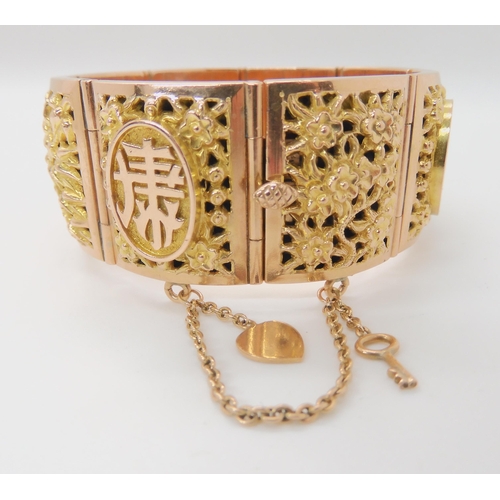 715 - A 14K GOLD CHINESE BANGLE