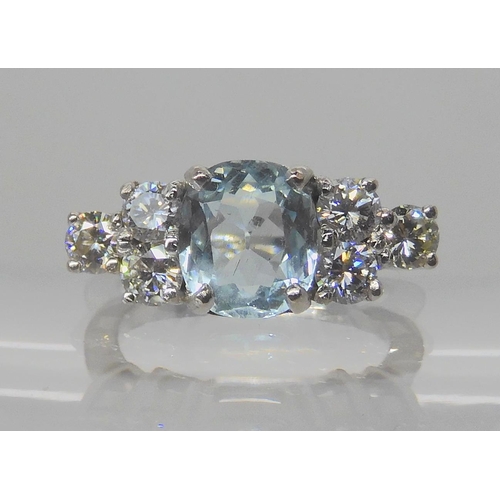 715A - AN 18CT WHITE GOLD AQUAMARINE AND DIAMOND RING