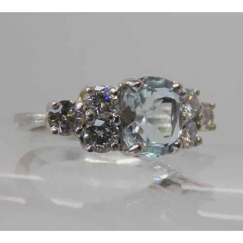 715A - AN 18CT WHITE GOLD AQUAMARINE AND DIAMOND RING