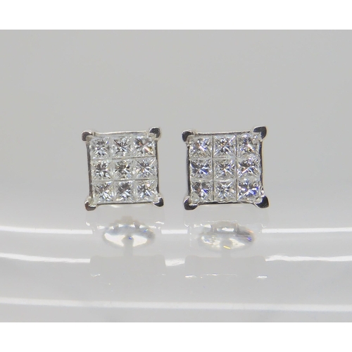 722A - A PAIR OF PLATINUM PRINCESS CUT DIAMOND EARRINGS