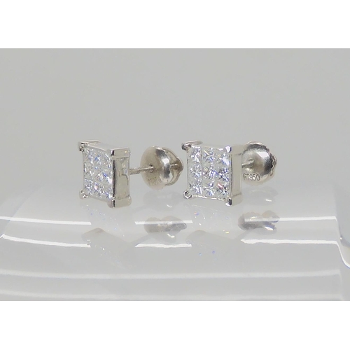 722A - A PAIR OF PLATINUM PRINCESS CUT DIAMOND EARRINGS