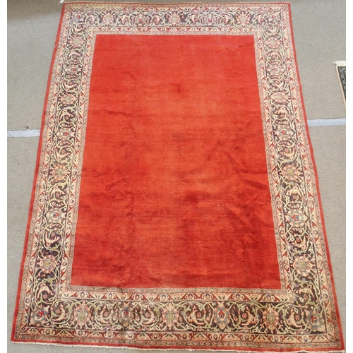 100 - A RED GROUND SAROUGH RUG