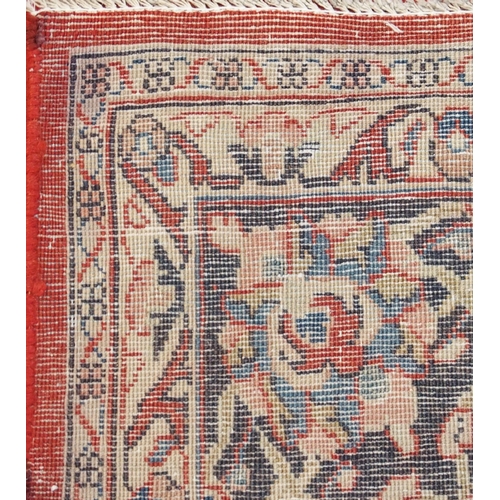 100 - A RED GROUND SAROUGH RUG