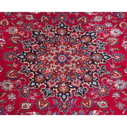 102 - A RED GROUND KESHAN RUG