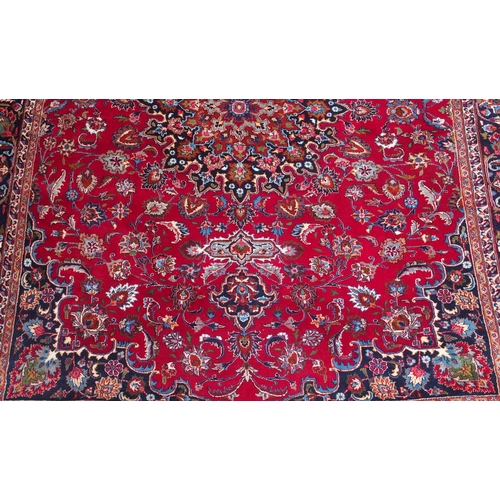 102 - A RED GROUND KESHAN RUG