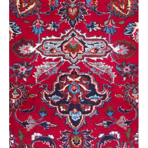 102 - A RED GROUND KESHAN RUG