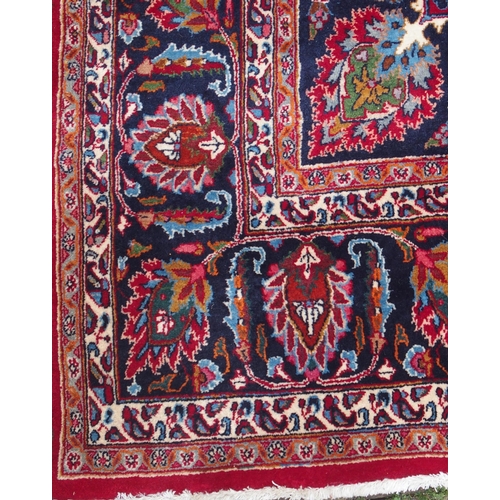 102 - A RED GROUND KESHAN RUG