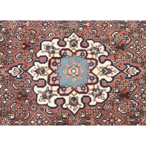 103 - A PINK GROUND ASFAHAN RUG