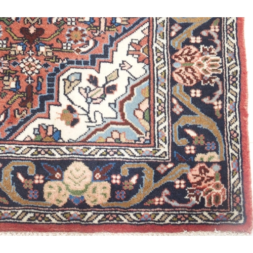 103 - A PINK GROUND ASFAHAN RUG