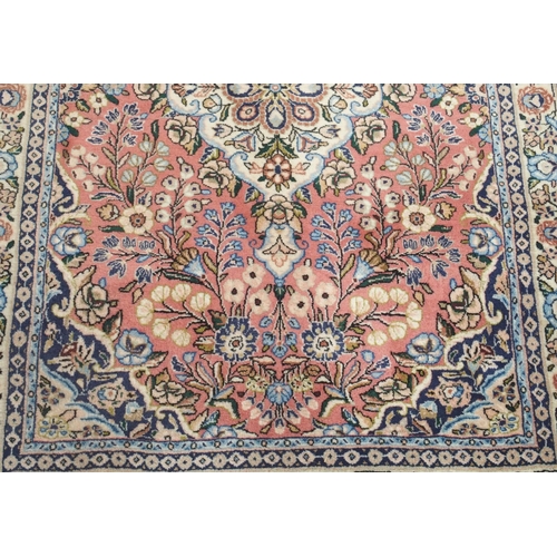 105 - A PINK GROUND EASTERN RUG