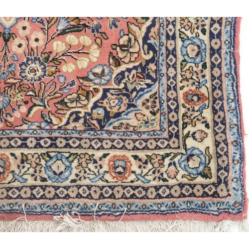 105 - A PINK GROUND EASTERN RUG