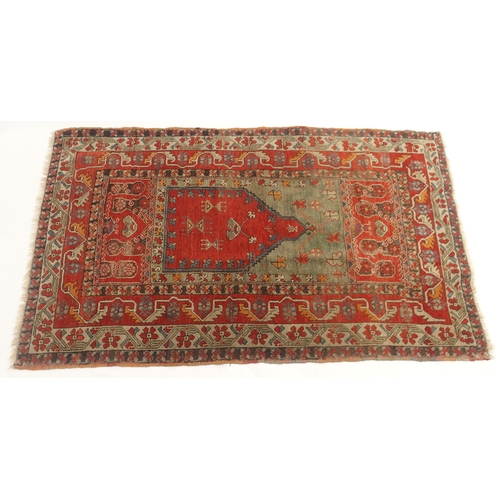 109 - A RED GROUND CAUCASIAN RUG