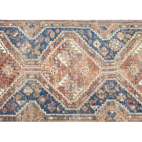 109 - A RED GROUND CAUCASIAN RUG