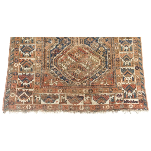 109 - A RED GROUND CAUCASIAN RUG