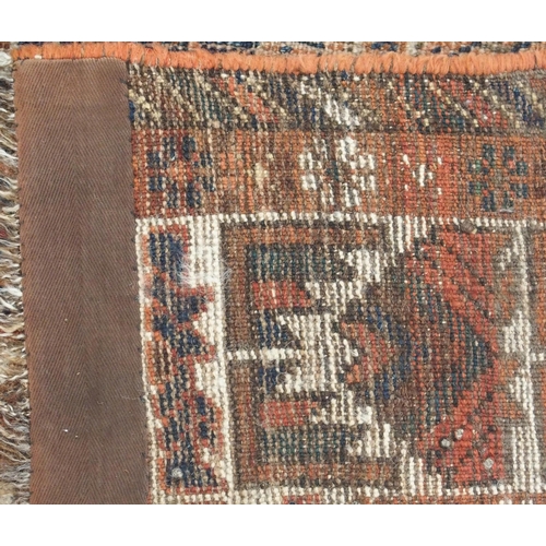 109 - A RED GROUND CAUCASIAN RUG