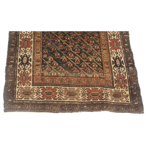 109 - A RED GROUND CAUCASIAN RUG