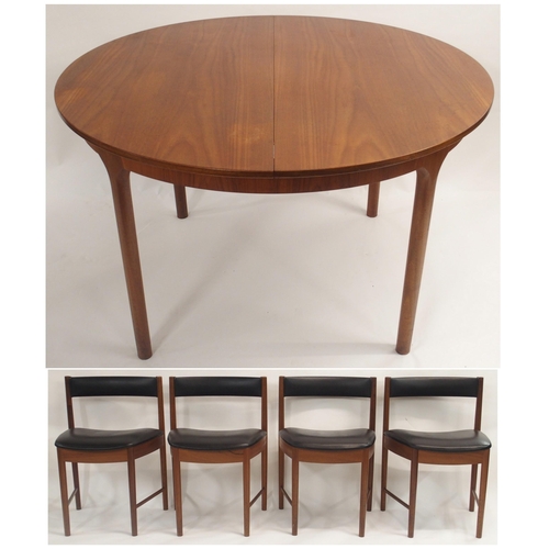 122 - A MCINTOSH OF KIRKCALDY TEAK CIRCULAR EXTENDING DINING TABLE