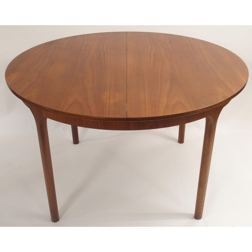 122 - A MCINTOSH OF KIRKCALDY TEAK CIRCULAR EXTENDING DINING TABLE