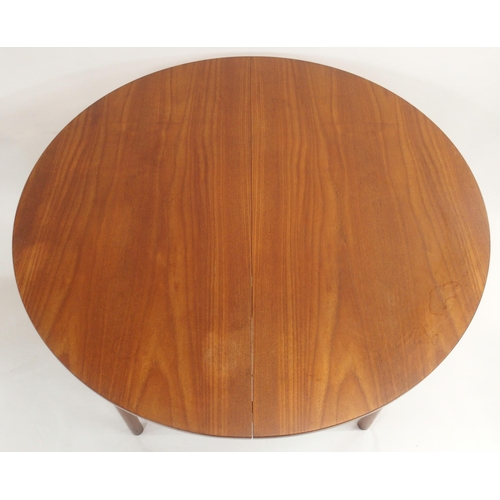 122 - A MCINTOSH OF KIRKCALDY TEAK CIRCULAR EXTENDING DINING TABLE